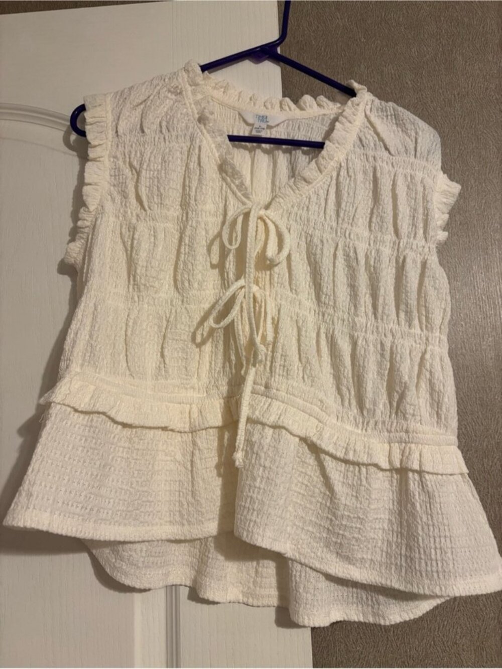 Cream Textured Tie-Front Ruffle Sleeveless Top